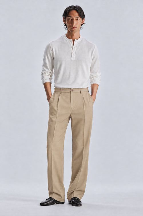 Beige Tailored Trousers styled with the white long sleeve henley, front
