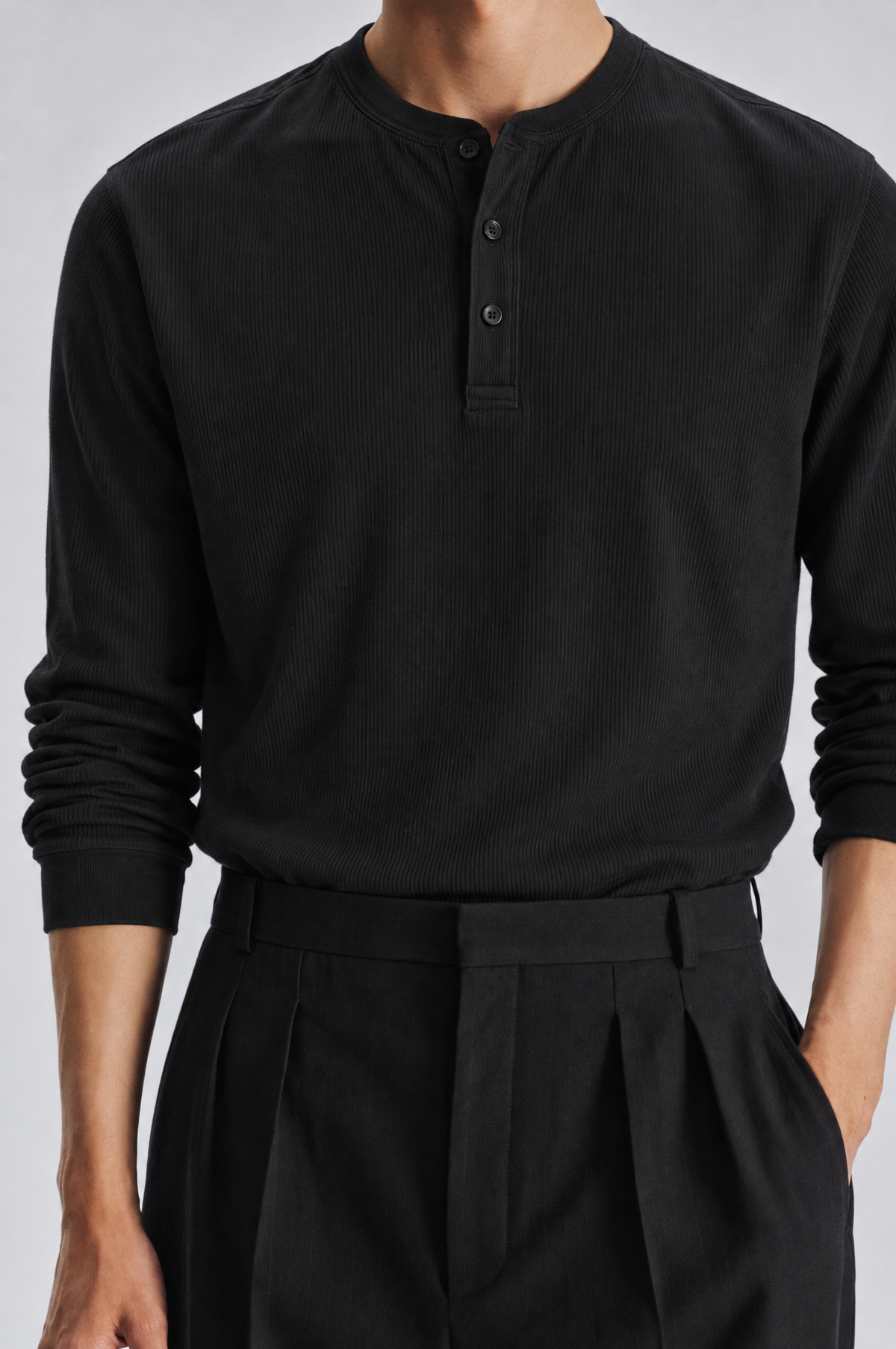 Black long sleeve henley shirt, close-up