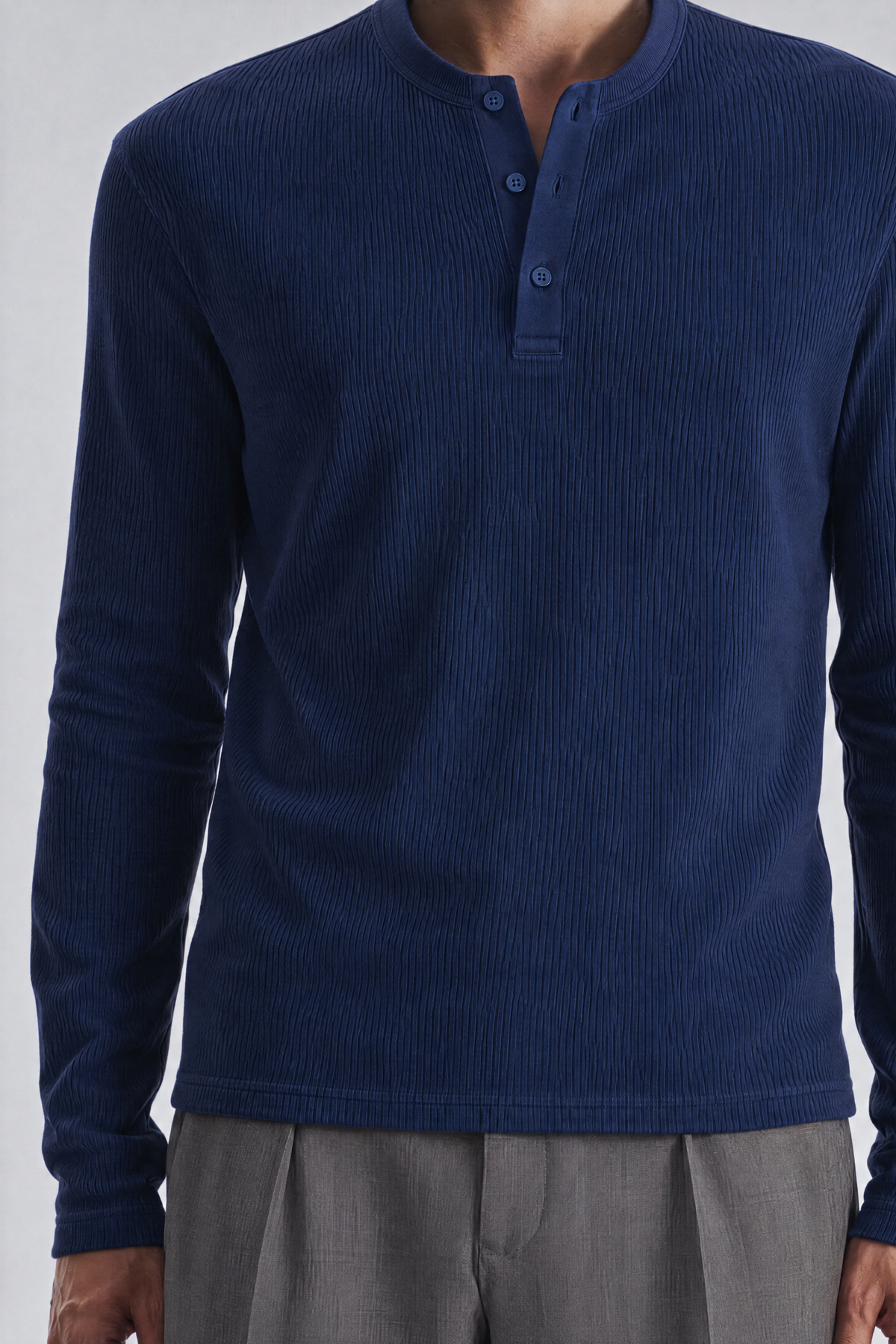 Navy long sleeve henley shirt, placket close-up